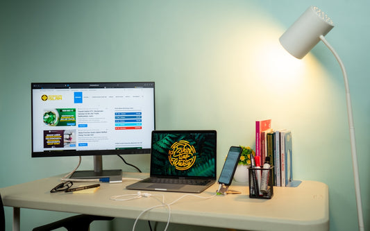 a laptop and a desktop computer on a desk
