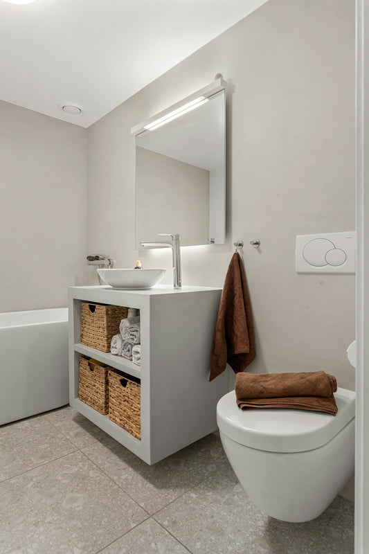 A bathroom with a toilet, sink, and bathtub