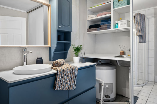 A bathroom with a sink and a shower