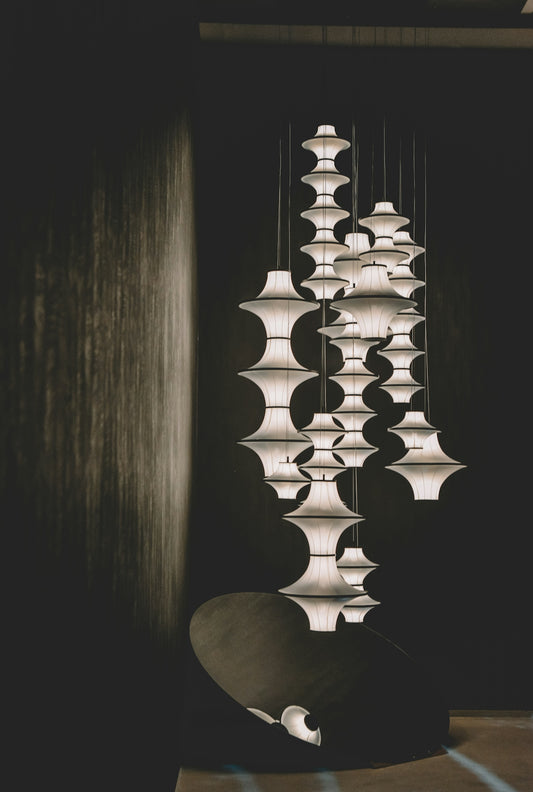 Modern pendant lights hanging in a dark room.
