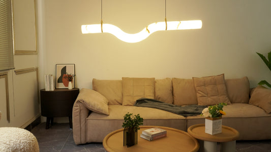Modern living room with beige sofa and contemporary lamp.