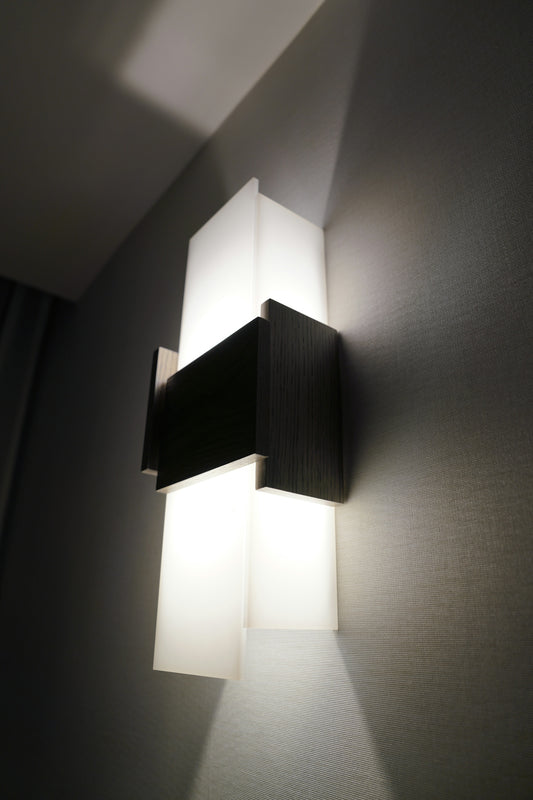 Modern wall sconce with geometric design