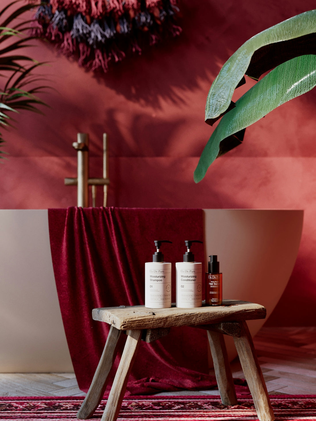 Luxurious red bathroom with bath products on a wooden stool.